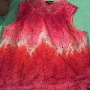 A kids see through top and a pink tank top